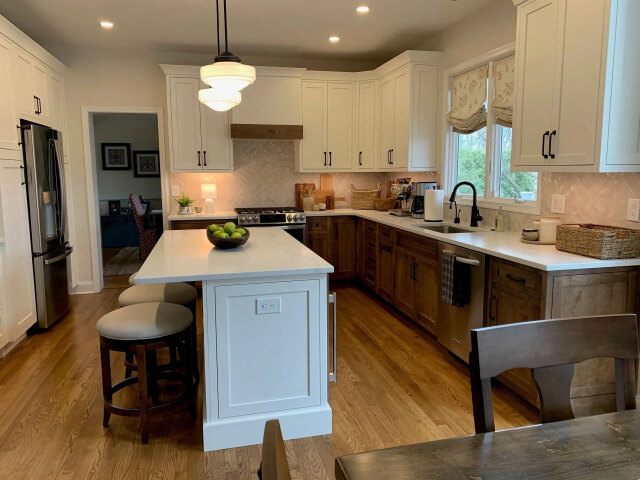 Beautiful country kitchen remodeling with white cabinets and hardwood floors, done by DMB Contracting.