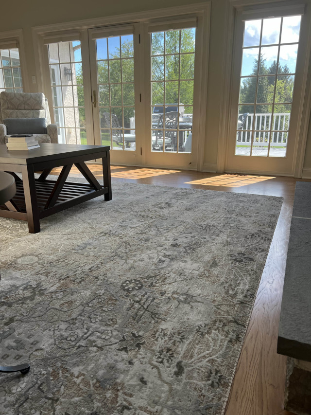 We removed the existing carpet and finished the hardwood floors beneath to match neighboring floors and create a warm, inviting living space.