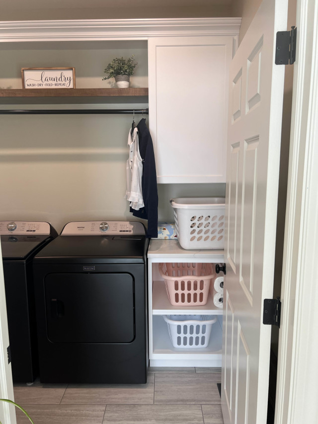 Open shelving and pull-out baskets offer practical organization options, making laundry tasks more efficient and tidy.