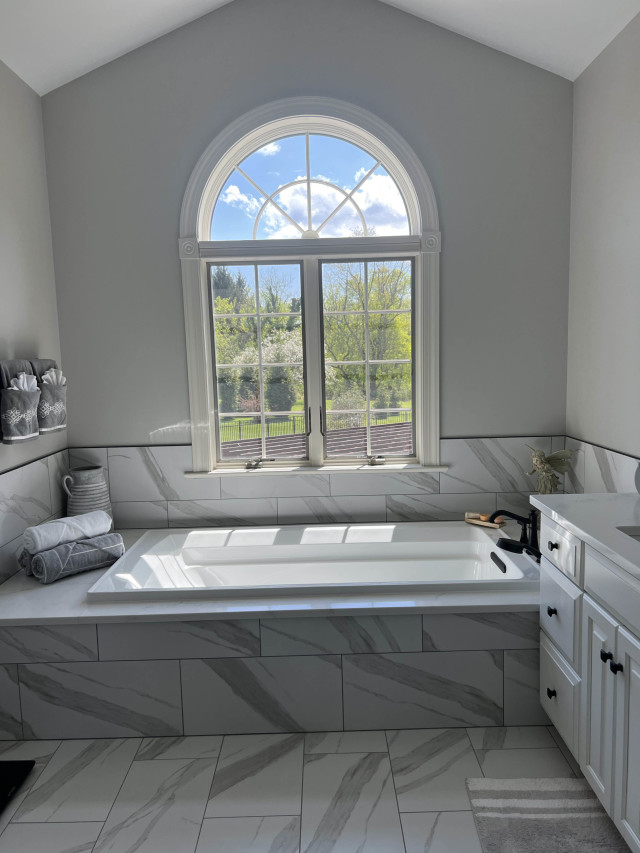 Custom Bathtub with Quartz Surround
We replaced the old jacuzzi with a custom quartz tub deck to provide a modern, clean aesthetic that’s easy to maintain.