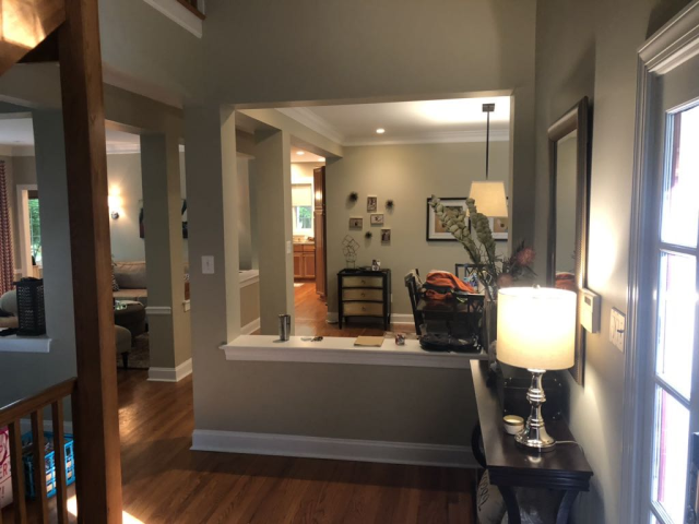 Mudroom Hooks and Cabinetry
Wall hooks and upper cabinets add practicality while keeping the mudroom clean and clutter-free.