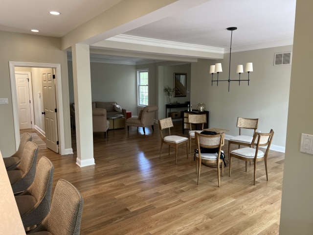 Refinished Flooring and Modernized Trim
The refinished hardwood and new trim work bring warmth and sophistication to the bedroom, complementing its traditional furniture.