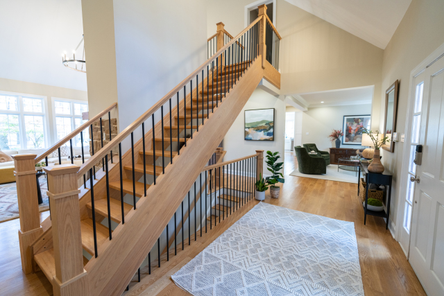 Custom Mudroom Bench and Storage
Built-in cabinetry and a wooden bench with boot space beneath provide organized storage and a warm, welcoming entryway.