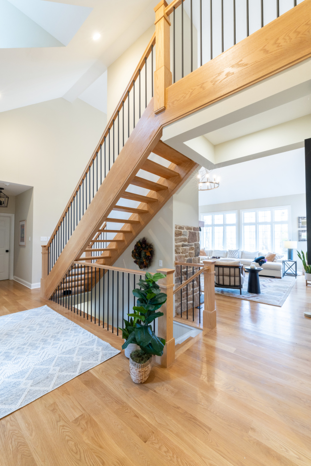Mudroom Hooks and Cabinetry
Wall hooks and upper cabinets add practicality while keeping the mudroom clean and clutter-free.