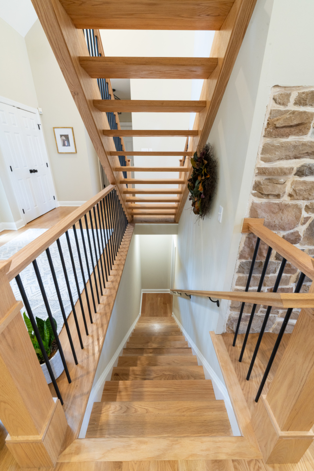 Bench Detail with Wainscoting
The wooden bench surface contrasts with crisp white cabinetry, with wainscoting adding subtle texture to the design.