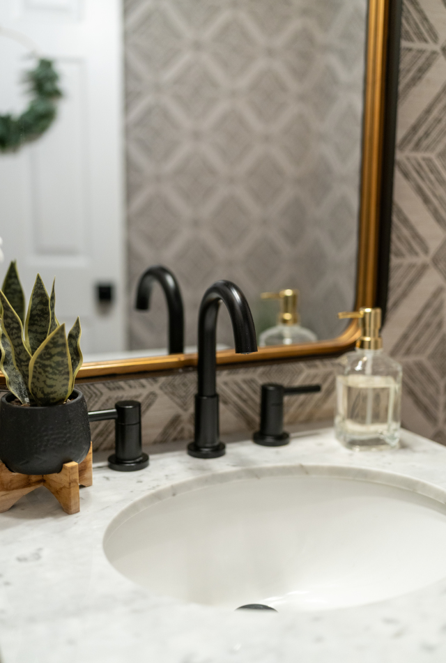 Bright Dining Area and Peninsula
The redesigned peninsula integrates storage and counter space, with the granite finish extending into the dining area for a unified design. Consistent flooring and recessed lighting connect the spaces seamlessly.
